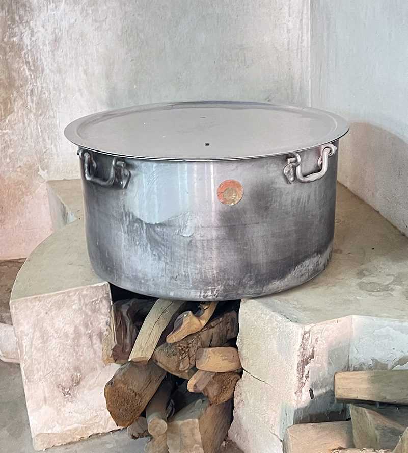 A man kindly offers food to a woman and another man oase Al Ain--()