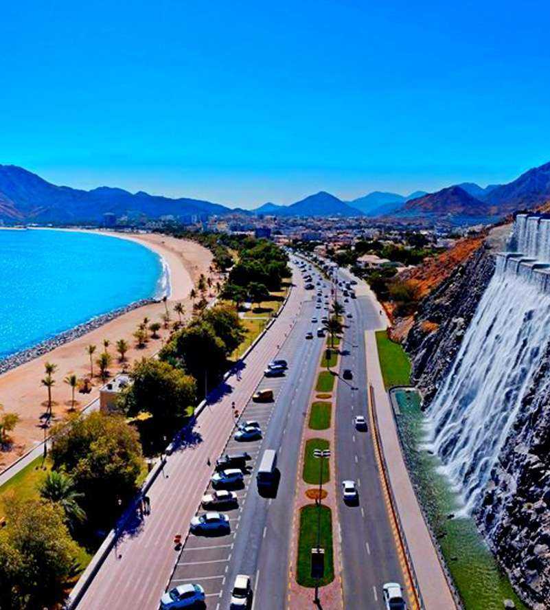 A scenic golf course at Dubai Golf Club with lush greenery and water features