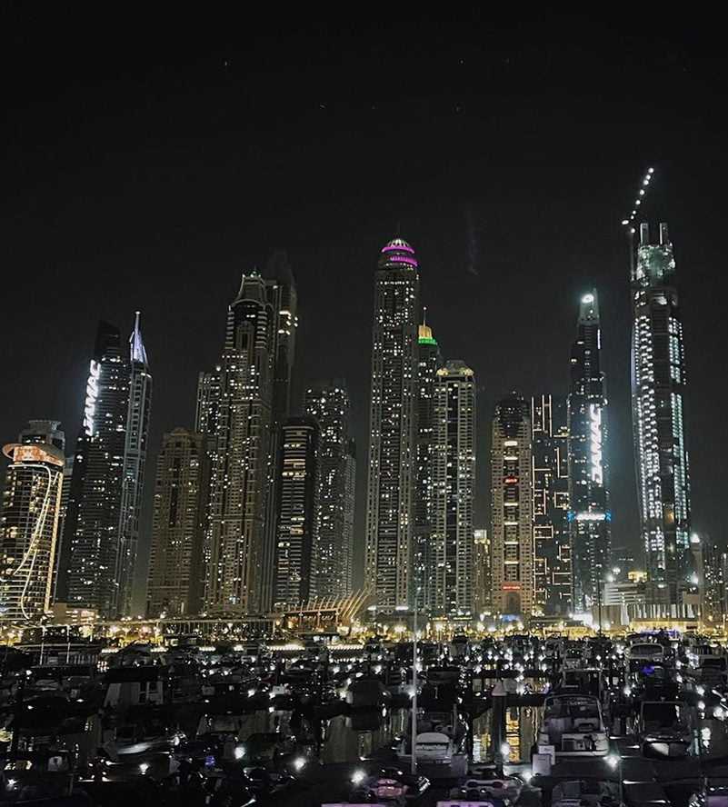 A stunning night view of Dubai, showcasing its iconic skyscrapers and illuminated cityscape-Cruise Dubai