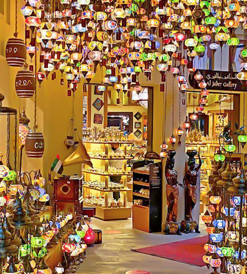 A well-lit store with numerous lamps hanging from the ceiling Dubai