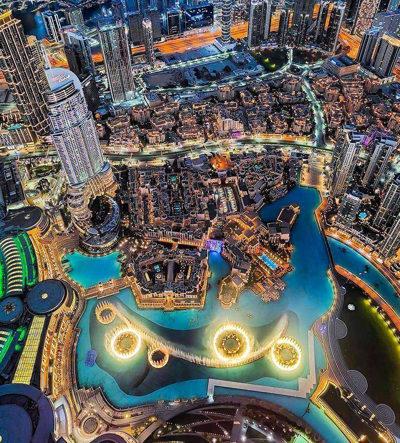Aerial view of Dubai skyline with towering skyscrapers and blue waters Dubai