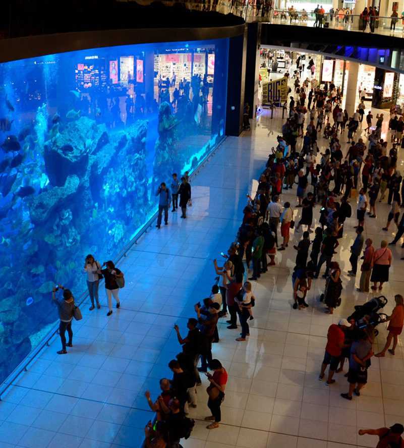 Burj Khalifa A man sitting on a glass floor-