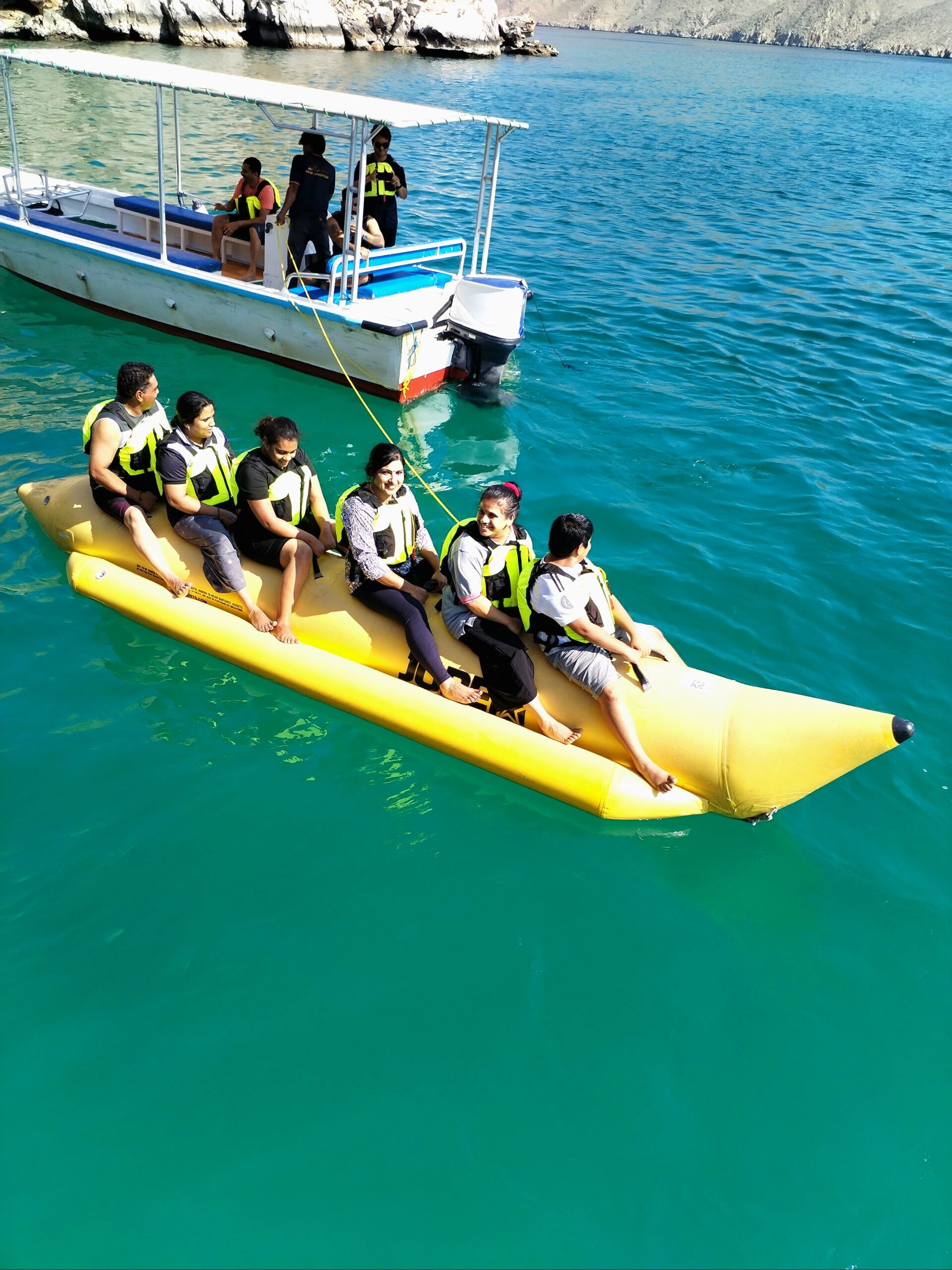 Fun and excitement during a banana boat ride on a yellow inflatable boat