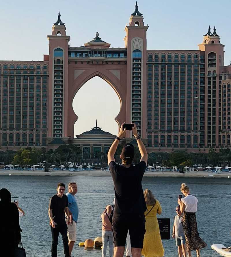 People capturing the iconic Atlantis Hotel in Dubai