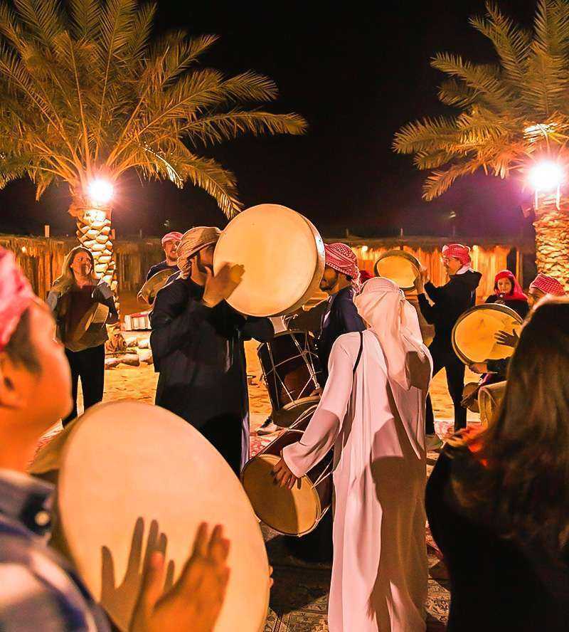 People drumming in desert Dubai