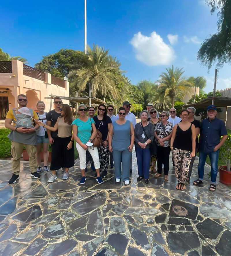 People posing for photo in front of Sheikh Zayed Grand Mosque copy