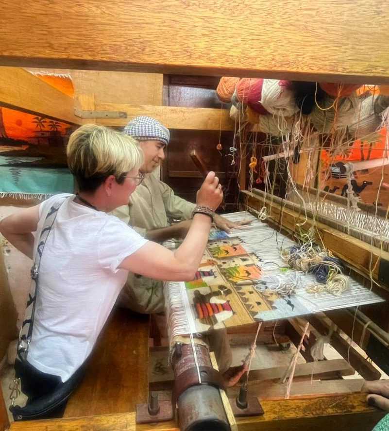 a person in a black robe-Abu Dhabi