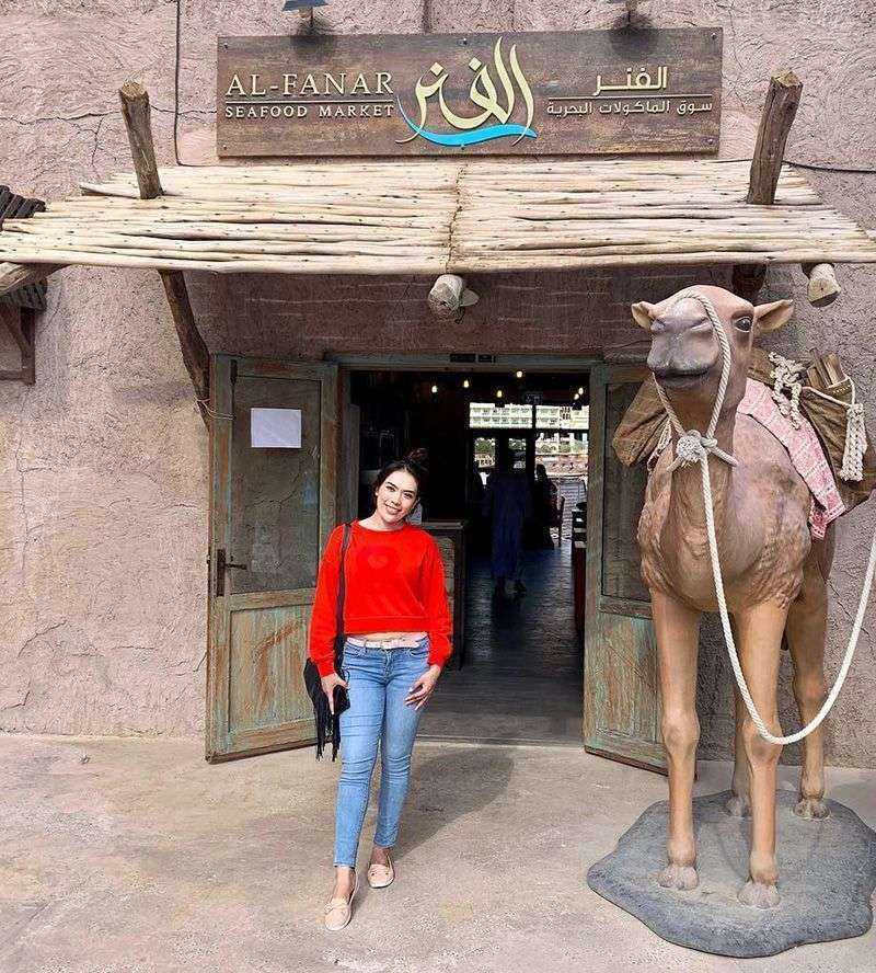 a woman with a camel