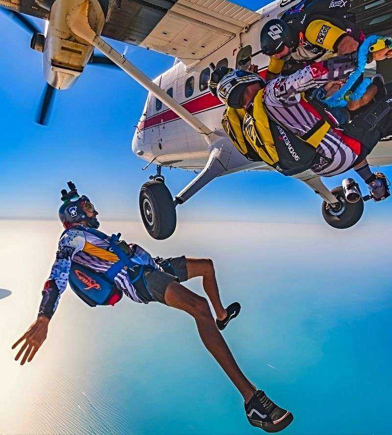 group of people jumping off an airplane