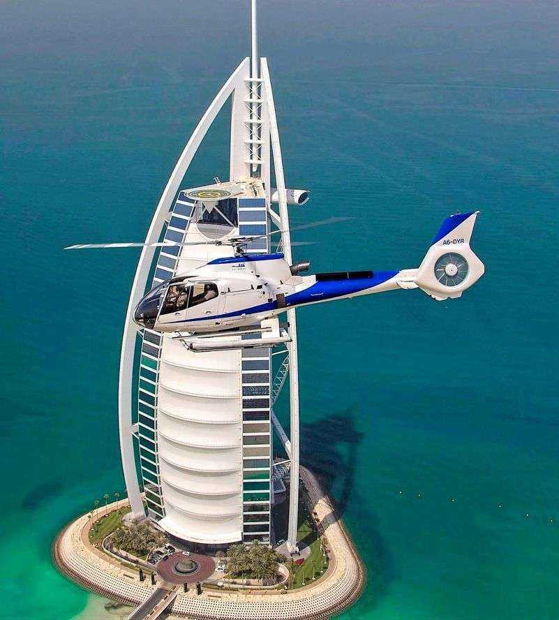 helicopter flying over Burj Al Arab
