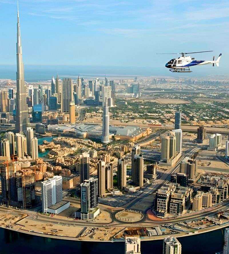 helicopter flying over Dubai city