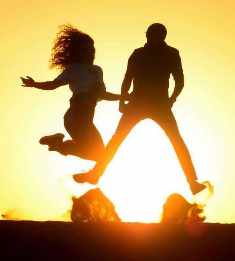silhouette of a person and a person jumping in the air