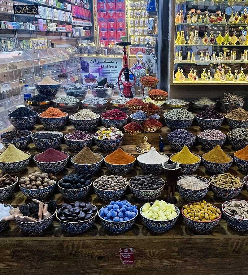vibrant display of aromatic spices in a bustling bazaar dubai market